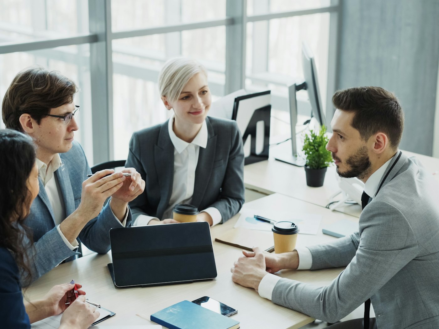 The Sirius team collaborating in a modern office